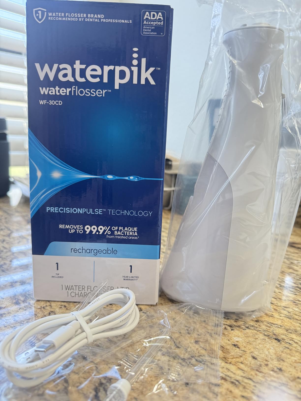 Waterpik Cordless 1100 Rechargeable Portable Water Flosser for Teeth Cleaning and Flossing, Travel, Braces Care, Healthier Gums, Waterproof for Shower, ADA Accepted, WF-30CD White, Packaging May Vary customer photo 2