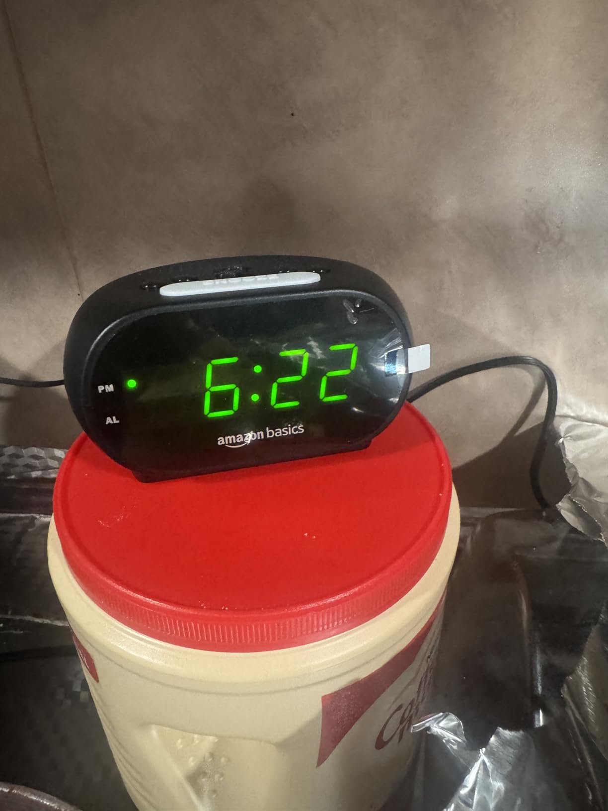 Amazon Basics Small Digital Oval Alarm Clock with LED Display, Nightlight, Snooze Function & Battery Backup, Black, 4.5 x 3.5 x 2.4 Inches customer photo 1