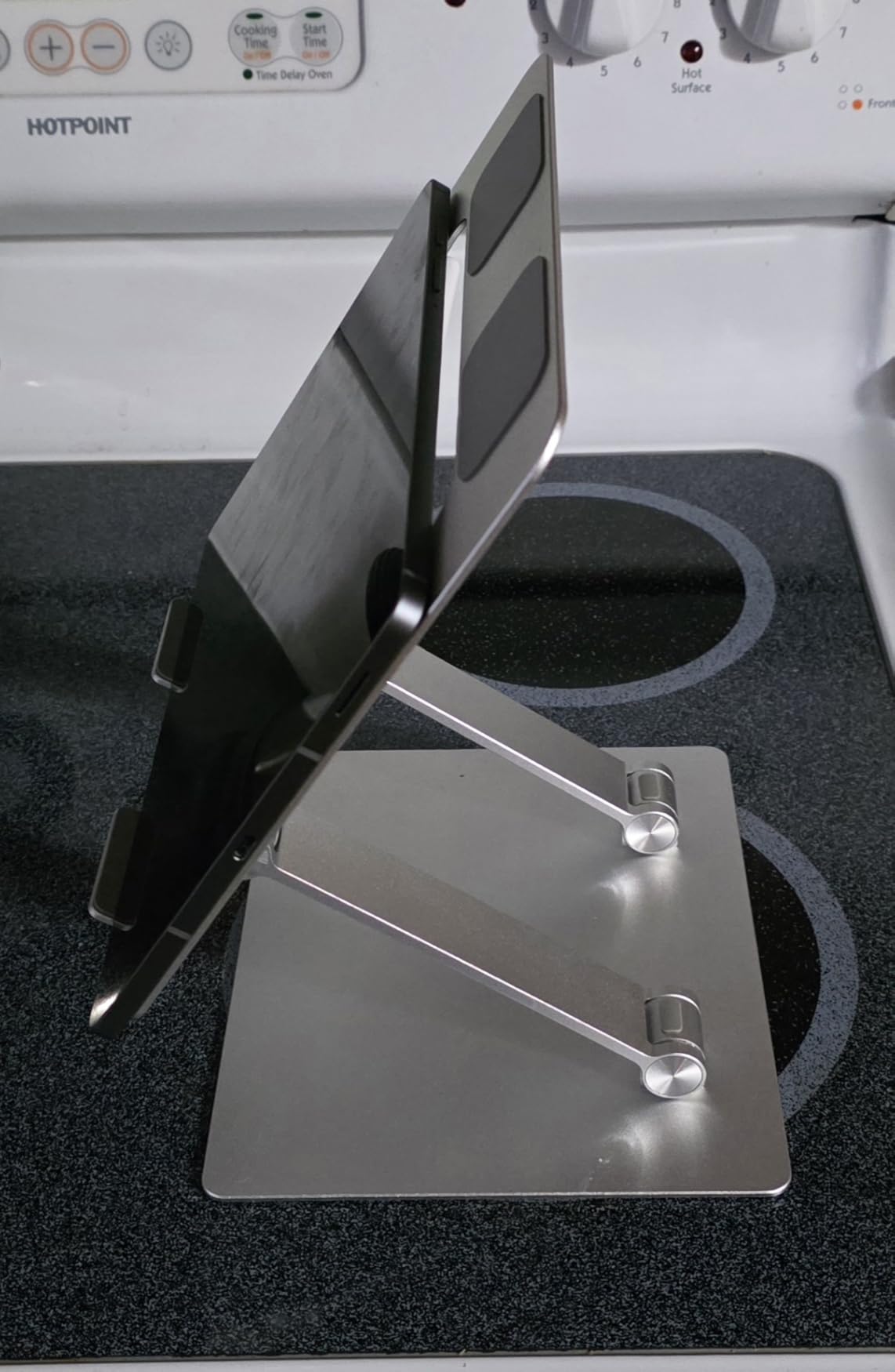 Amazon Basics Sturdy and Portable Ergonomic Laptop Stand for Desk, Height Adjustable Riser with Ventilated Cooling, Foldable, Fits all Laptops up to 15.6 Inch, Silver customer photo 1