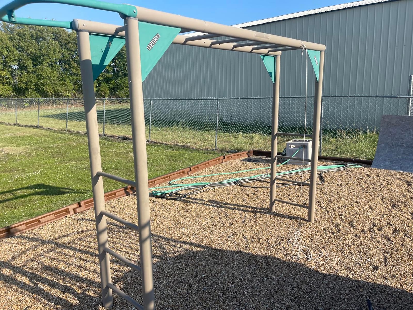 Lifetime Adventure Tower Deluxe Swing Set Playset Lifetime Adventure Tower, Covered Clubhouse, 9 ft Wavy Slide, Monkey Bars, Climbing Wall, Fireman’s Pole, Belt Swings & Trapeze customer photo 2