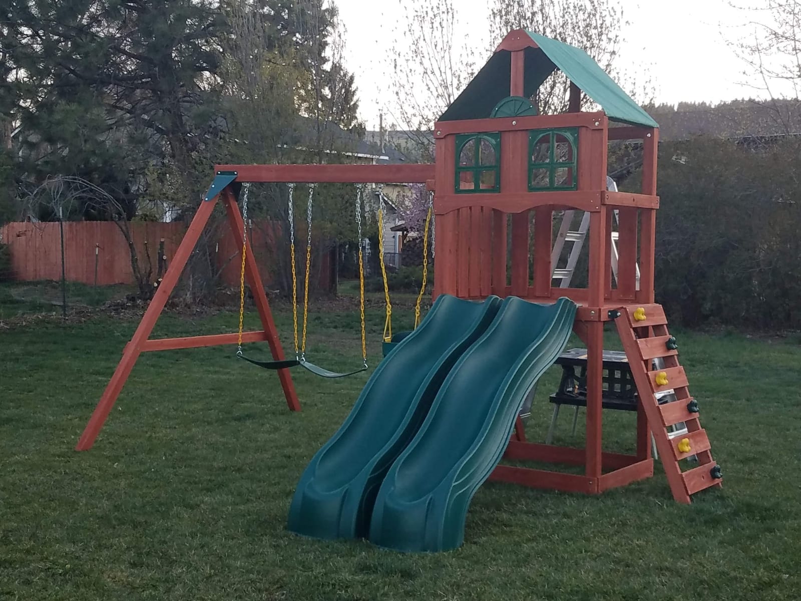 Gorilla Playsets 01-1057-GREY Playmaker Deluxe Wooden Swing Set with Dual Gray Wave Slides, Vinyl Canopy Roof, Swings, and Rock Climbing Wall, Redwood Stained Cedar (Amazon Exclusive) customer photo 2