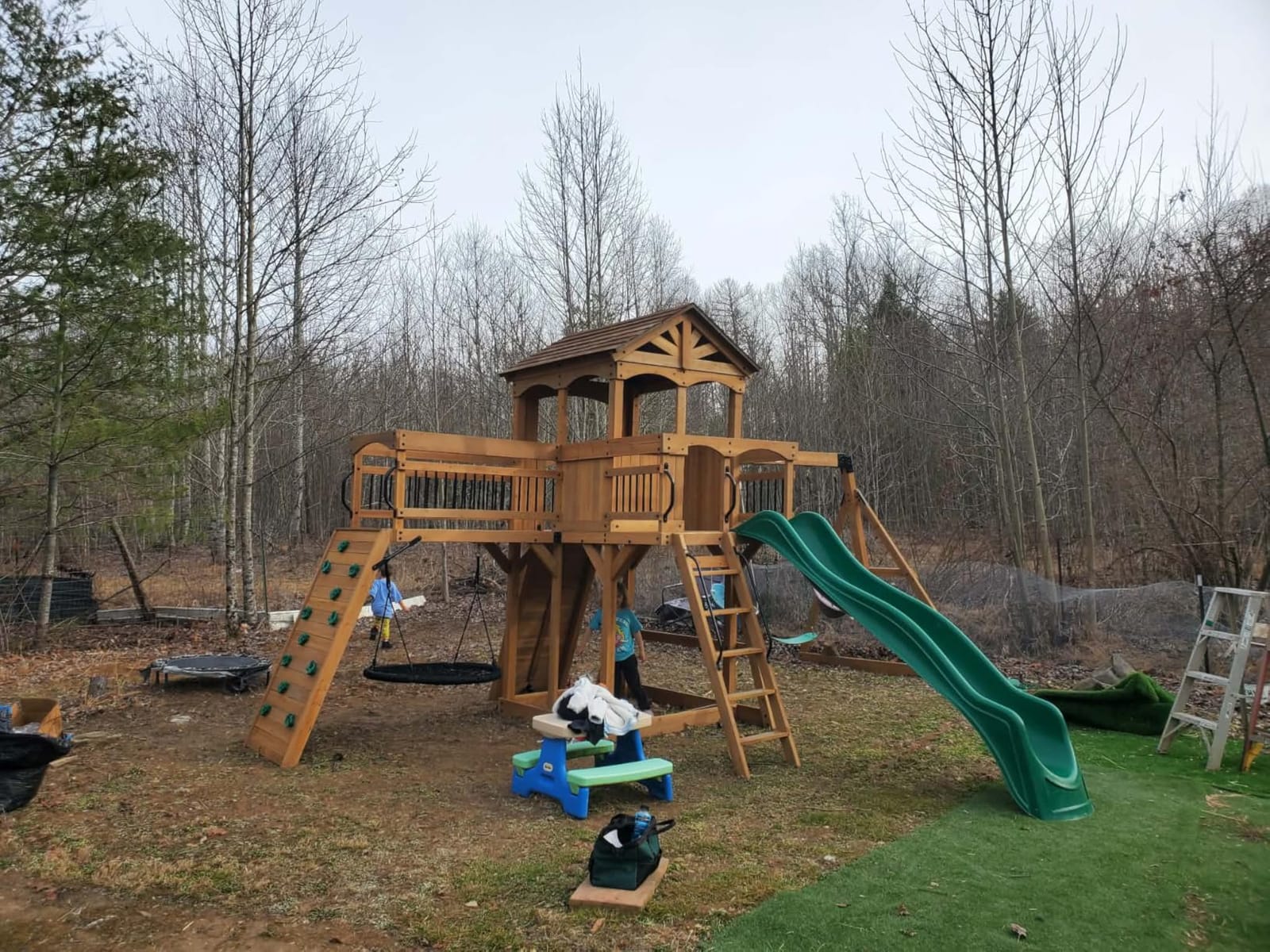 Backyard Discovery Dover Bay Spruce Wood Swing Set with Spiral Tube Slide, Wave Slide, Clubhouse, Rock Wall, Belt Swings, Step Ladder, Toy Telescope, Chalkboard, Outdoor Playset customer photo 2