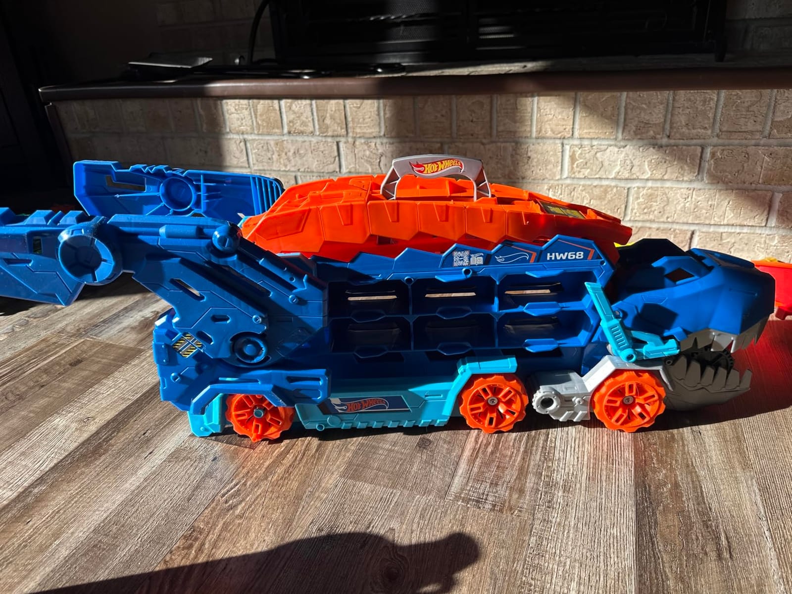 Hot Wheels City Toy Car Track Set, Ultimate T-Rex Transporter, Hauler Transforms into Stomping Dino with Race Track, from Netflix Series “Let’s Race” customer photo 2